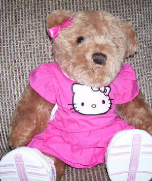 Susan bear wearing an helly kitty outfit.